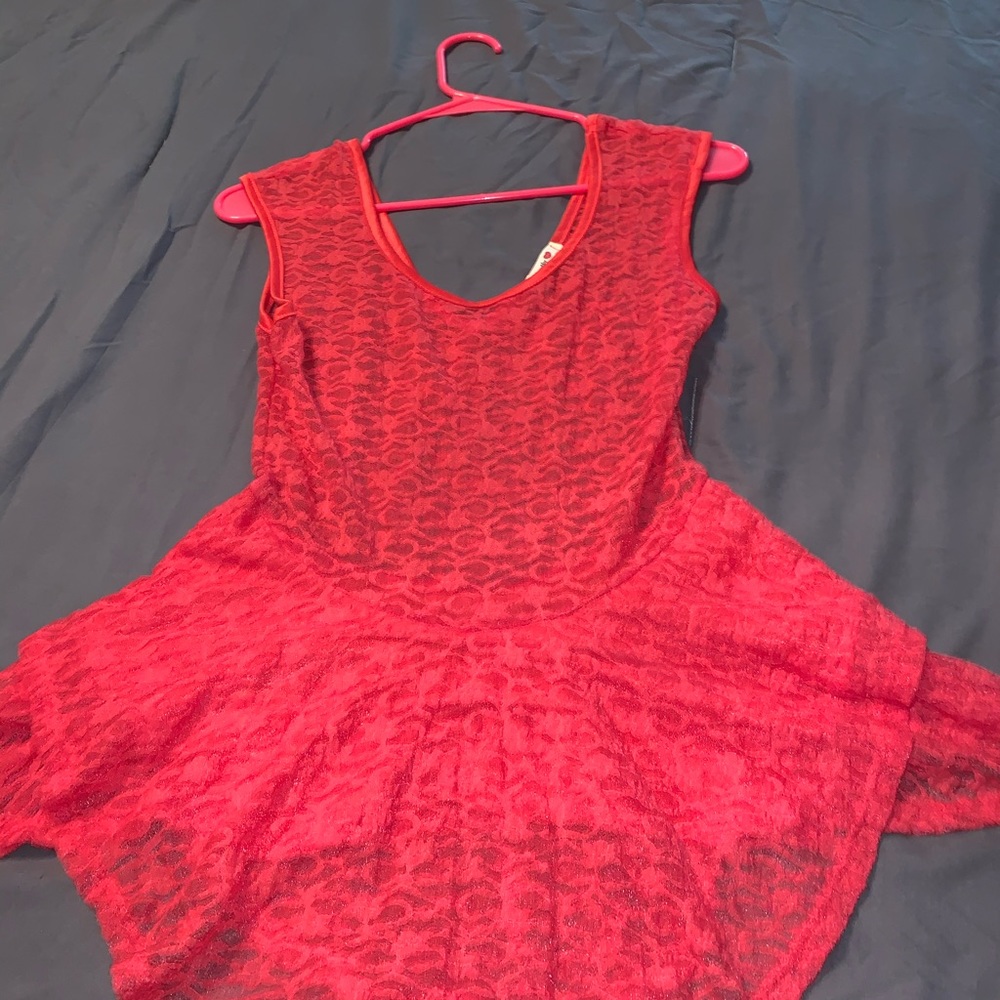 Sheer lace top. Asymmetrical hem.